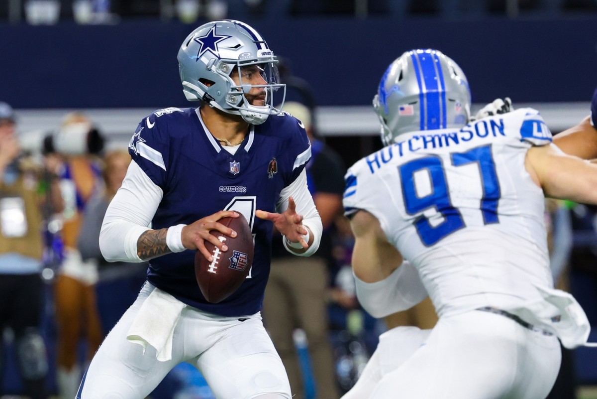 Dallas Cowboys quarterback Dak Prescott (4) throws as Detroit Lions defensive end Aidan Hutchinson (97) rushes during the second half at AT&T Stadium.